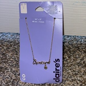 Claire’s Gold Capricorn necklace
